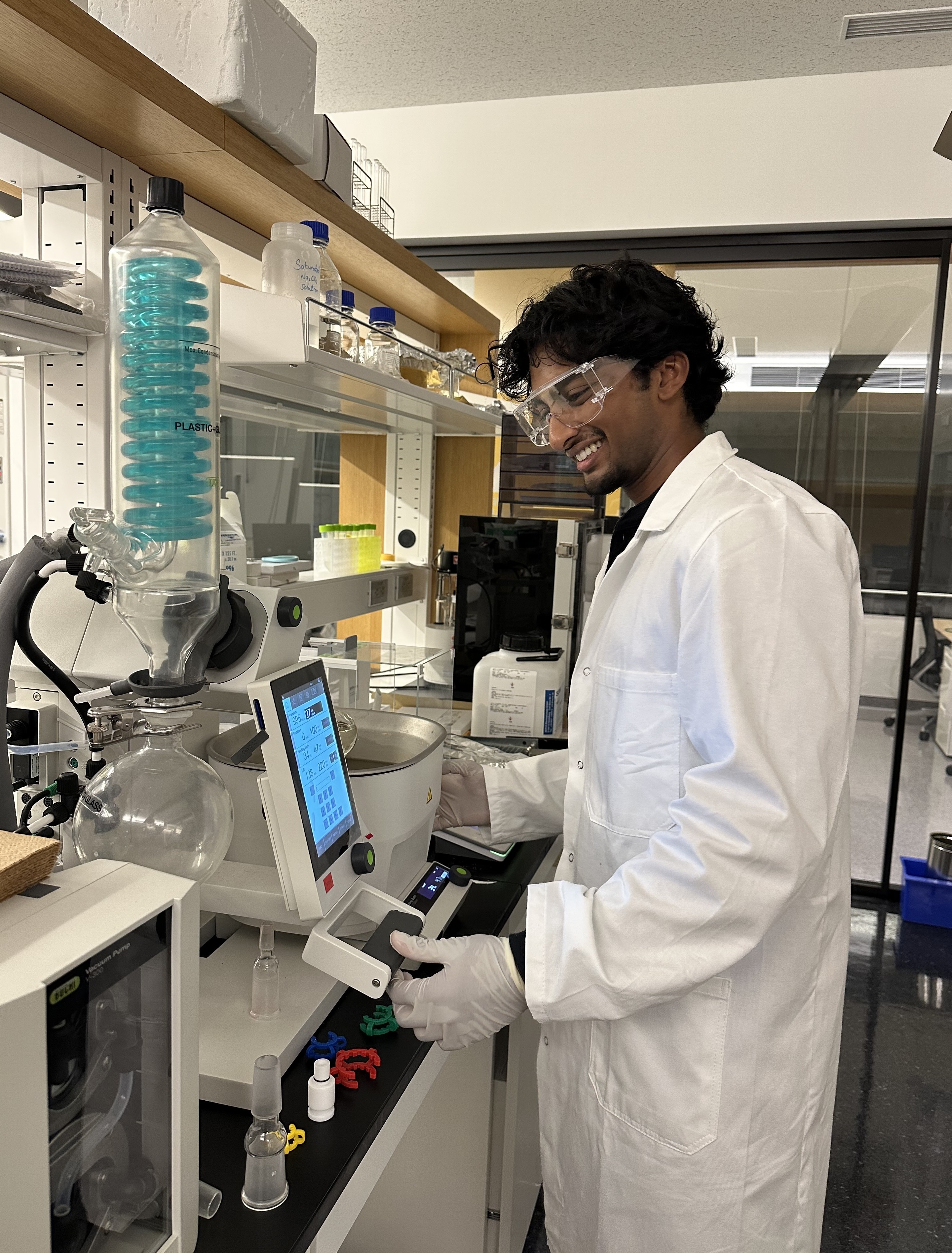 John standing alongside lab instrumentation.